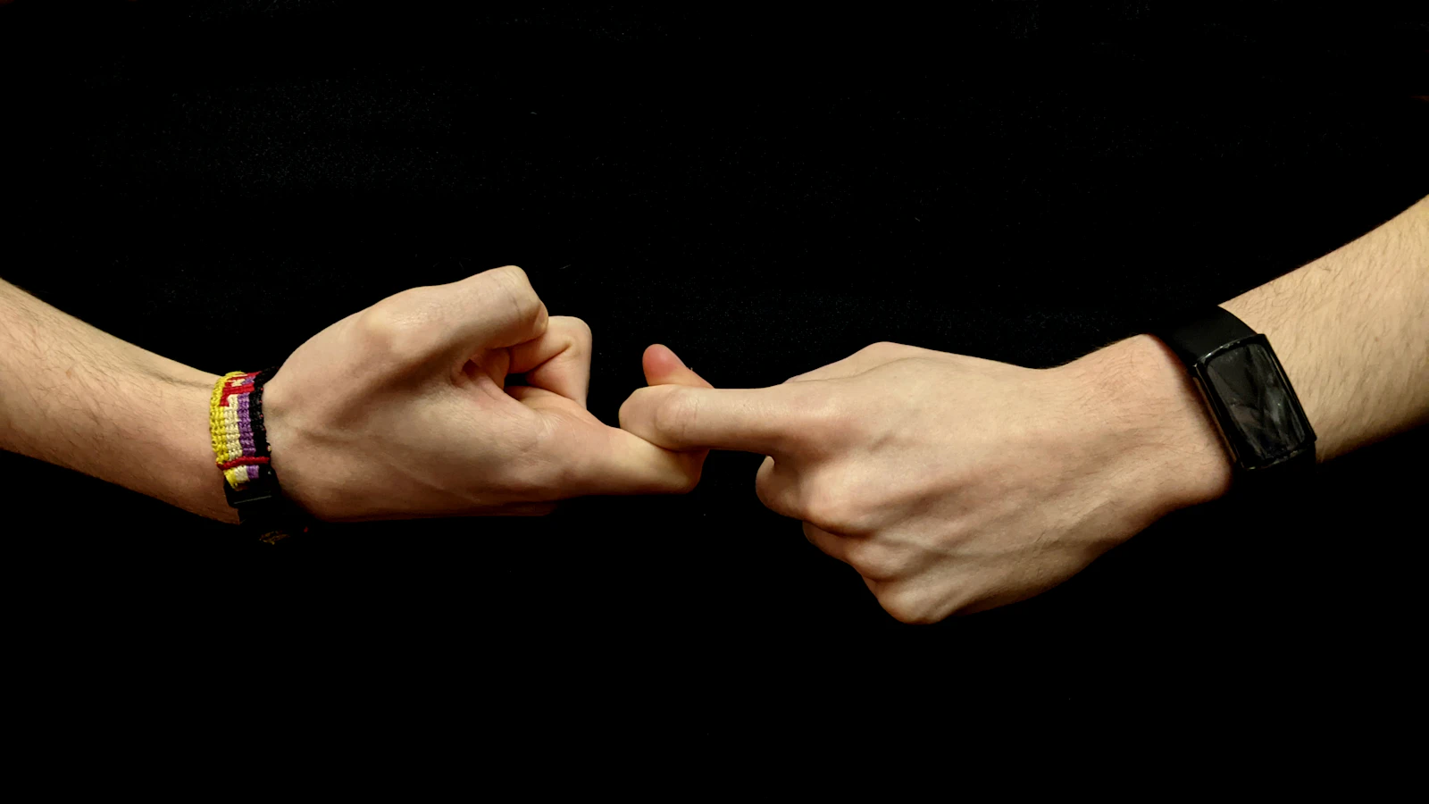 Two hands signing the word friendship in American Sign Language